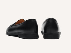 Stride Penny Loafers in Black Moorland Calf with Dark Sole
