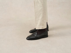 Stride Penny Loafers in Black Moorland Calf with Dark Sole