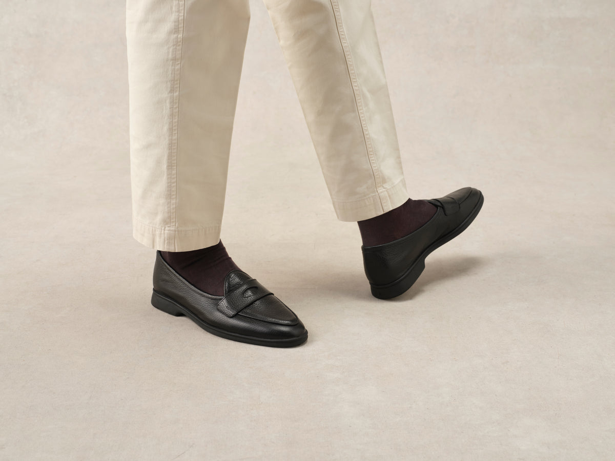 Stride Penny Loafers in Black Moorland Calf with Dark Sole